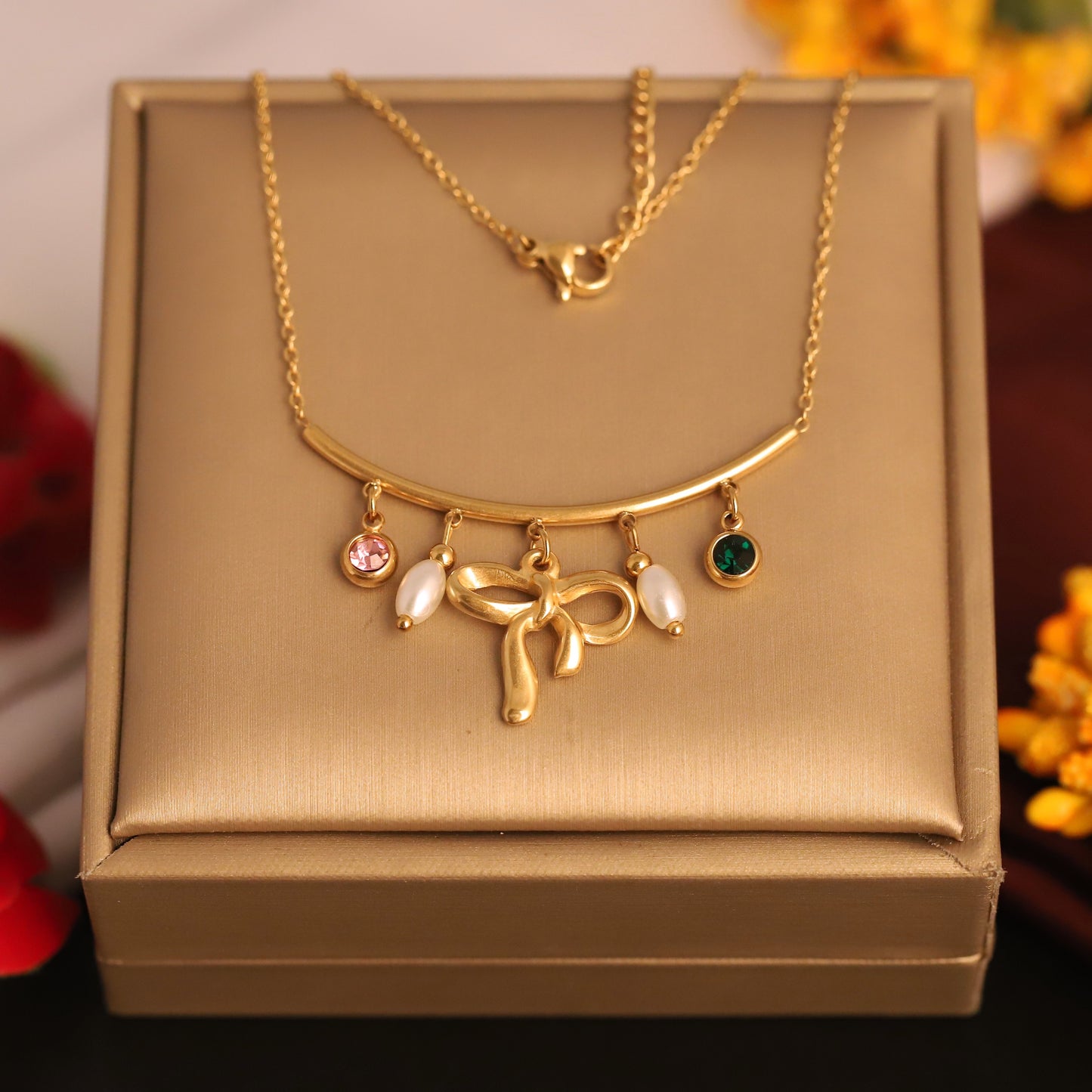 Elegant Gold Bow Necklace with Pearls & Gemstone Charms